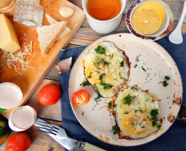 Scrambled eggs with fresh herbs and grated cheese