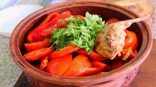 Rabbit stewed with vegetables and mushrooms in beer