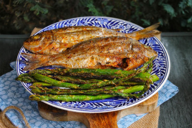 Dorada fish on coals on the grill