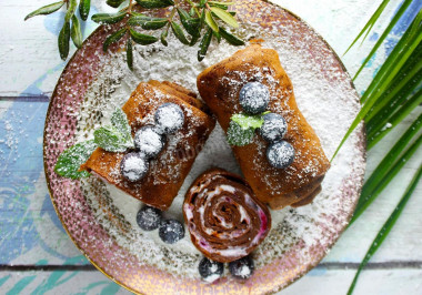 Chocolate pancake roll with cream