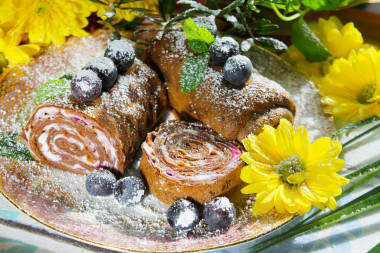 Chocolate pancake roll with cream