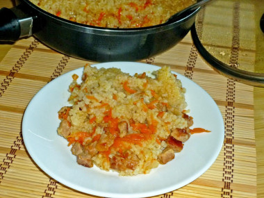 Pork pilaf in a deep frying pan