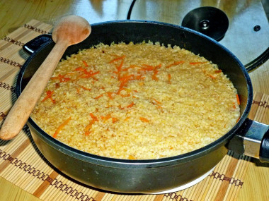 Pork pilaf in a deep frying pan