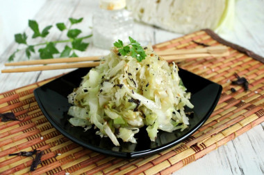 White cabbage with sesame seeds in a frying pan