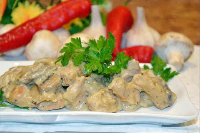 Stewed turkey with mushrooms in cream sauce