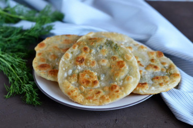 Tortillas with dill in a frying pan