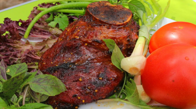 Veal shoulder blade in honey mustard glaze on the grill