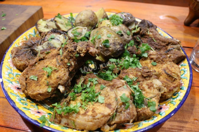 Steaks and Potatoes Baked On Charcoal On the Grill