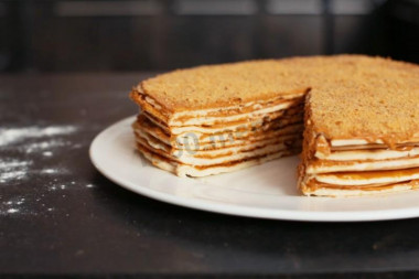 Cake cakes in a frying pan with boiled condensed milk