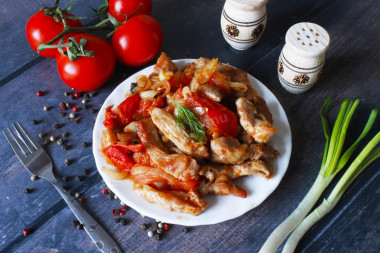 Pork with tomatoes in a frying pan