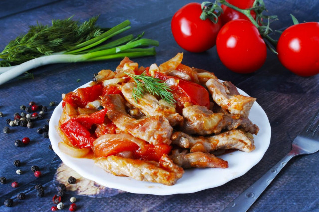 Pork with tomatoes in a frying pan