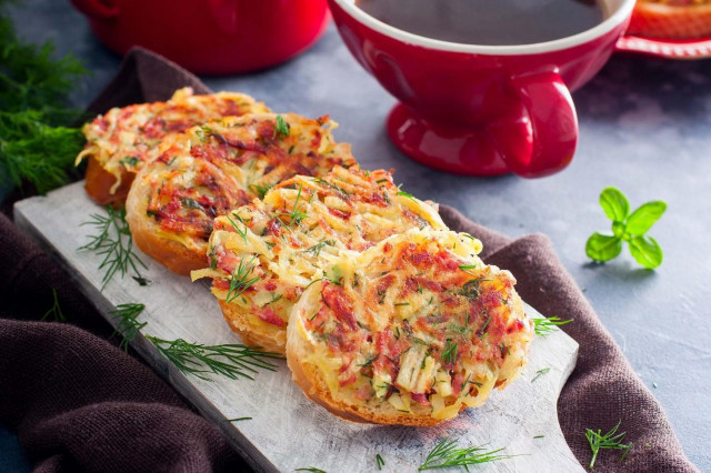 Sandwiches in a frying pan with sausage