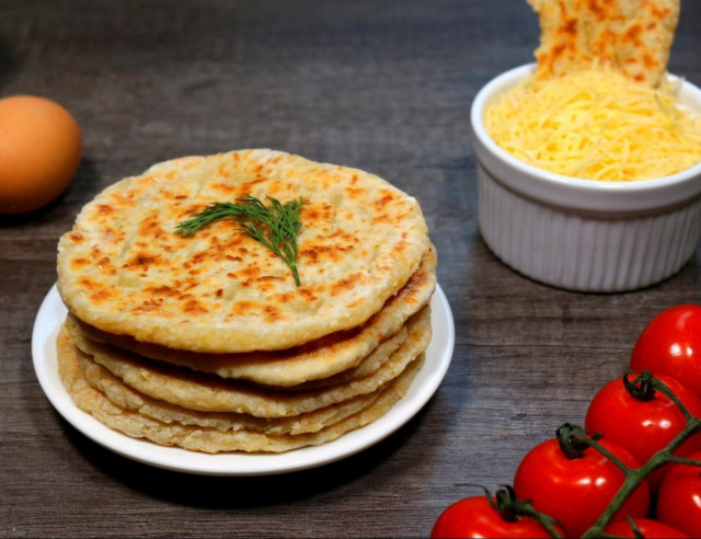 Cheese tortillas with milk in a frying pan