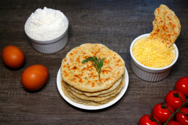 Cheese tortillas with milk in a frying pan