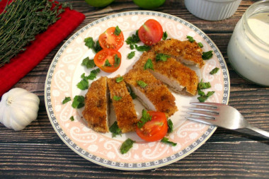 Juicy pork chops in a frying pan