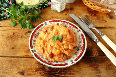 Meat with gravy in a frying pan