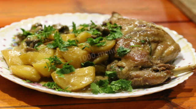 Rabbit stewed in cream in a cauldron