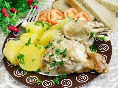 Rabbit stewed in sour cream with potatoes