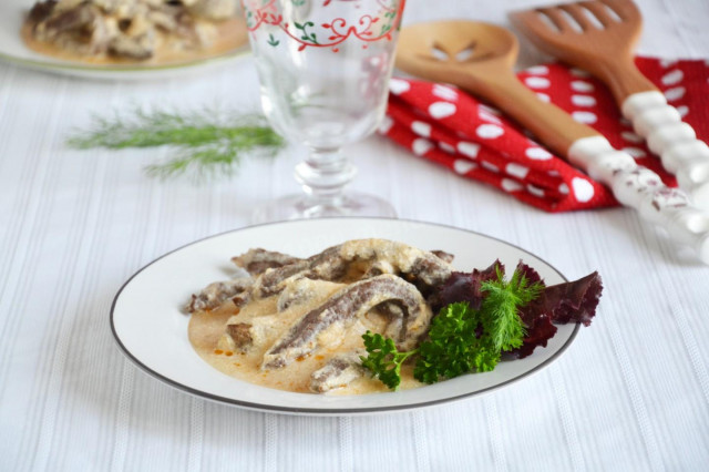 Beef Stroganoff with sour cream in a frying pan