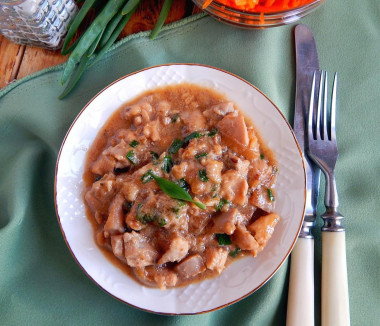 Chicken fillet in a pan in sauce