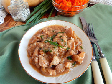 Chicken fillet in a pan in sauce