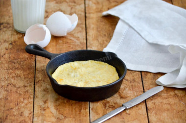 A simple omelet of eggs and milk in butter