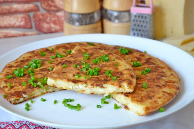 Khachapuri on rice flour in a frying pan