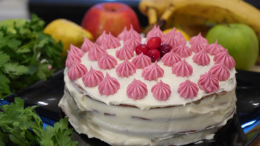 Vanilla sponge cake in a pan with cocoa powder