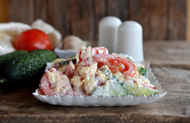 Tomato salad with cucumbers and cheese