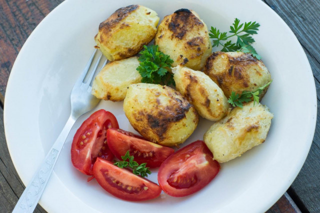 Potatoes boiled in a uniform and fried on the grill