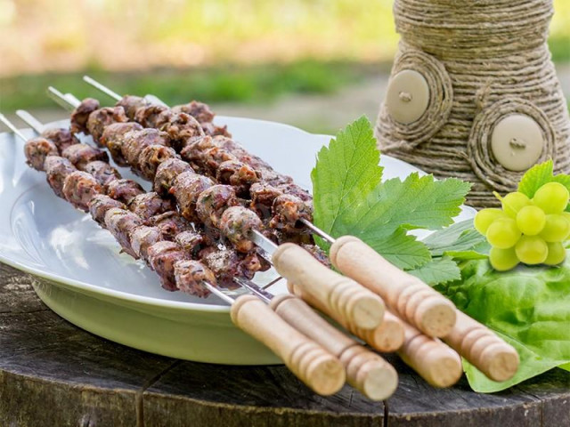 Barbecue of turkey hearts on the grill