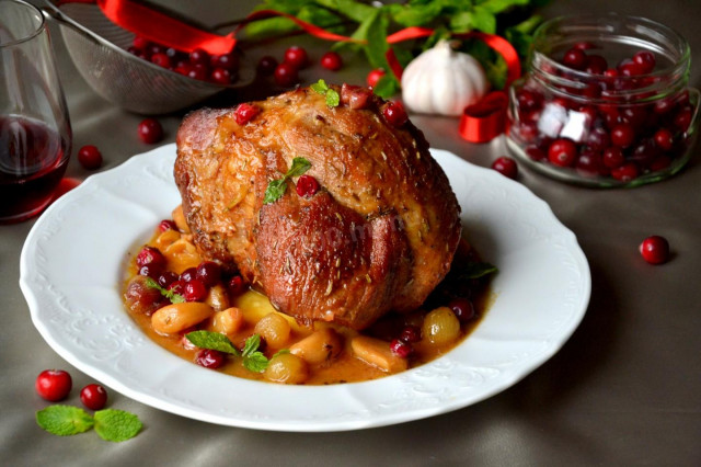 Pork ham in apple sauce with garlic and cranberries