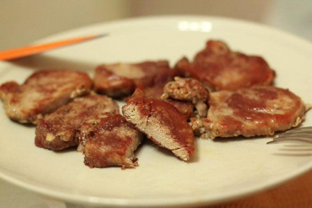 Pork tenderloin in a frying pan