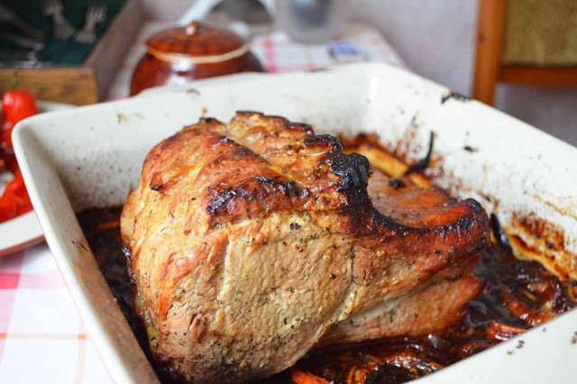 Pork loin with garlic and onion in the oven