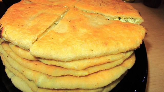 Moldovan placinds with cottage cheese and onions in a frying pan