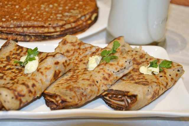 Thick buckwheat pancakes with milk