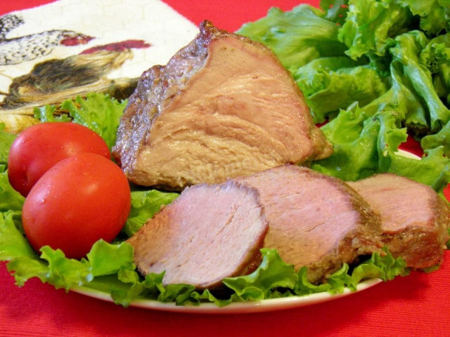 Baked pork neck in marinade on mineral water in the oven