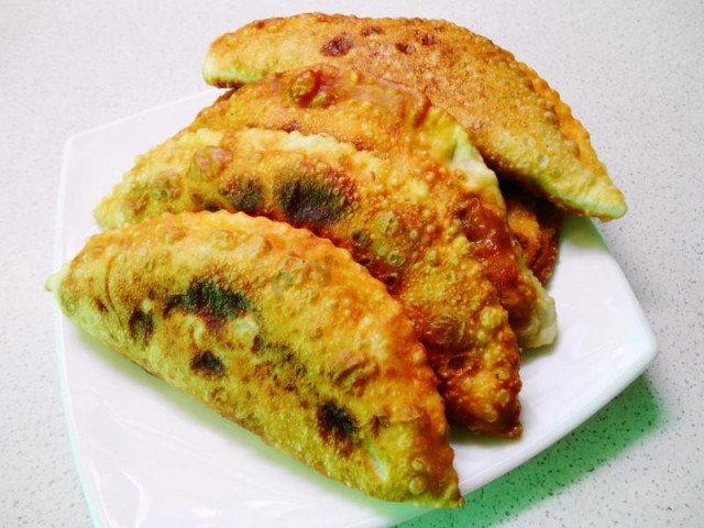 Chebureks from custard dough with vodka added