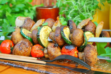 Shish kebab of mushrooms on the grill