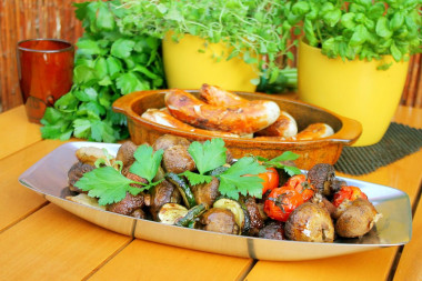 Shish kebab of mushrooms on the grill