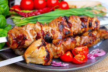 Shish kebab with tomatoes and pork onions