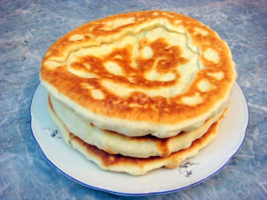 Tbilisi khachapuri with cheese in a frying pan