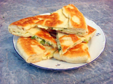 Tbilisi khachapuri with cheese in a frying pan