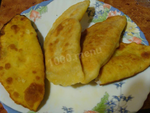 Chebureks with minced meat on custard dough