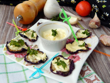 Eggplant in a pan with mayonnaise, fried with garlic