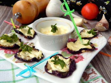 Eggplant in a pan with mayonnaise, fried with garlic