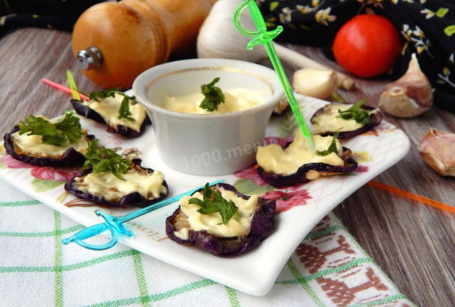 Eggplant in a pan with mayonnaise, fried with garlic