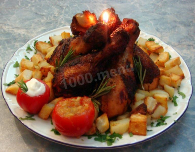 Fried chicken drumsticks in a pan with curry