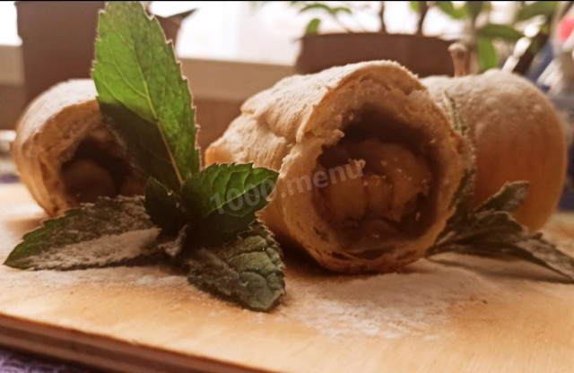 Strudel made of dough in water and olive oil with apples