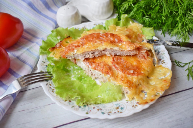 Pork chops baked in the oven with cheese